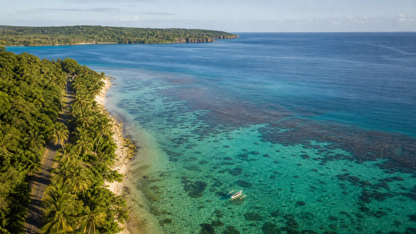 Aerial view of a tropical Vanuatu coastline and coral lagoon
